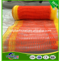 Orange and yellow netting for road construction